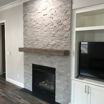 Jcustom Stone - Chiseled Marble Floor to Ceiling Fireplace - General Contractors Near Me