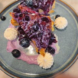 Very berry french toast with fresh berries  cream cheese and berry wine reduction.