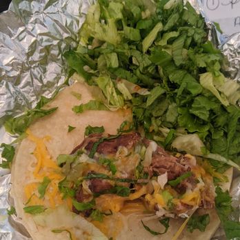 Wahoo's Fish Taco - 1998 Taco with barely any carnitas and a lot of lettuce. - Seafood Near Me - Foothill Ranch, California