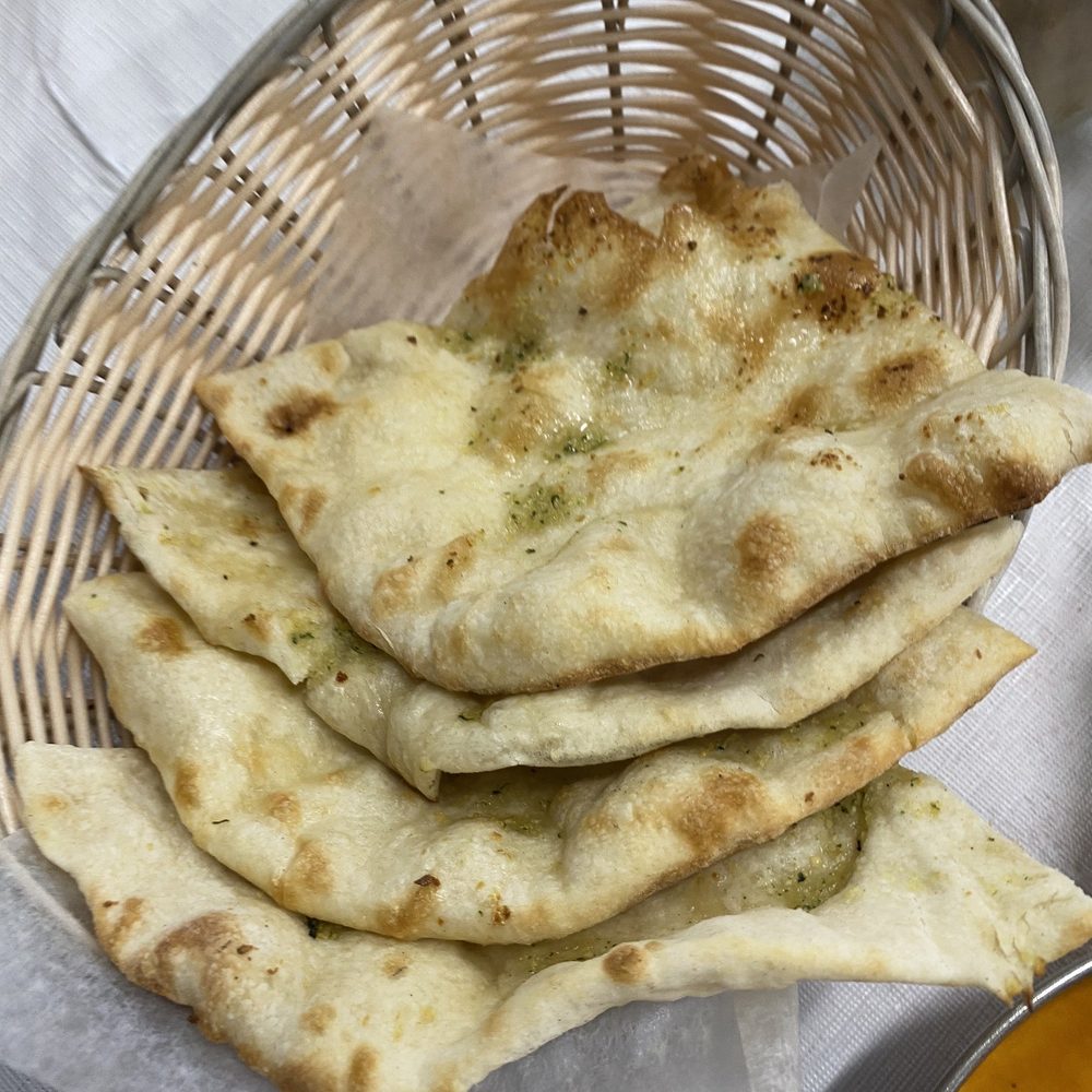 Royal Indian Restaurant - Garlic naan- a little sweeter than I am used to but still delicious. - Breakfast & Brunch Near Me - San Pablo, California Royal Indian Restaurant - Garlic naan- a little sweeter than I am used to but still delicious. - Breakfast & Brunch Near Me - San Pablo, California
