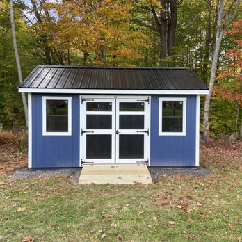 Total Property Maintenance - a blue shed with a metal roof - Landscaping Near Me - Brownfield, Maine Total Property Maintenance - a blue shed with a metal roof - Landscaping Near Me - Brownfield, Maine