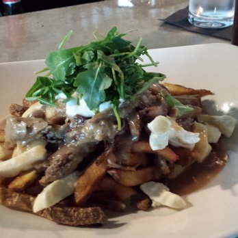 Bight Restaurant & Bar - Bight poutine, hand cut fries, shredded pork, thunder oak cheese curds, gravy arugula and sour cresm - Bars Near Me - Thunder Bay, Ontario