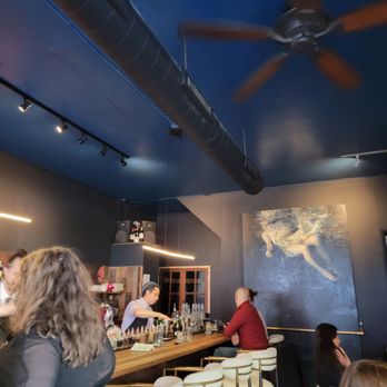 Salita - a group of people sitting at a bar - Cocktail Bars Near Me - Denver, Colorado