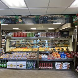 Wilkes' Delicatessen - The breakfast & sandwich menu with a display with other choices to choose from.