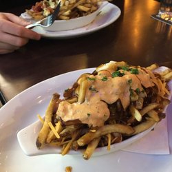 Leopold's Tavern - Osborne Village - In the back: The Montreal Smoked Meat Poutine and then The Smash Burger Poutine