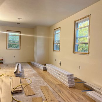Sens Flooring - a room with unfinished wood floors - Flooring Near Me - Billerica, Massachusetts