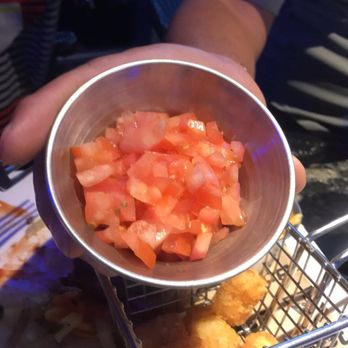 Topgolf - Diced tomatoes brought out over an hour after receiving our food. We had to ask for a slice of tomato because they forgot it on our burger.. - New American Near Me - Tucson, Arizona