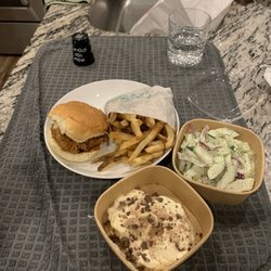 Bossy Beulah's Ft. Mill - Best Chicken Sandwich with a side of fries and banana pudding and cucumbers salad. Ps Chicken sandwich is the best to order.