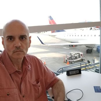 The Centurion Lounge - Bill Lewis of Cooper City, Florida, visiting the Centurian Lounge at SeaTac in Seattle, Washington. - Airport Lounges Near Me - Seattle, Washington