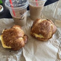 Iced coffee and sausage egg and cheese croissant breakfast sandwich's Iced coffee and sausage egg and cheese croissant breakfast sandwich's