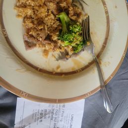 a plate of rice and broccoli