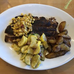 Blackened catch of the day, roasted vegetables and potatoes.