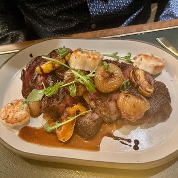 Highlands - 16 Oz Australian Ribeye with onions, squash, and scallops - New American Near Me - Detroit, Michigan
