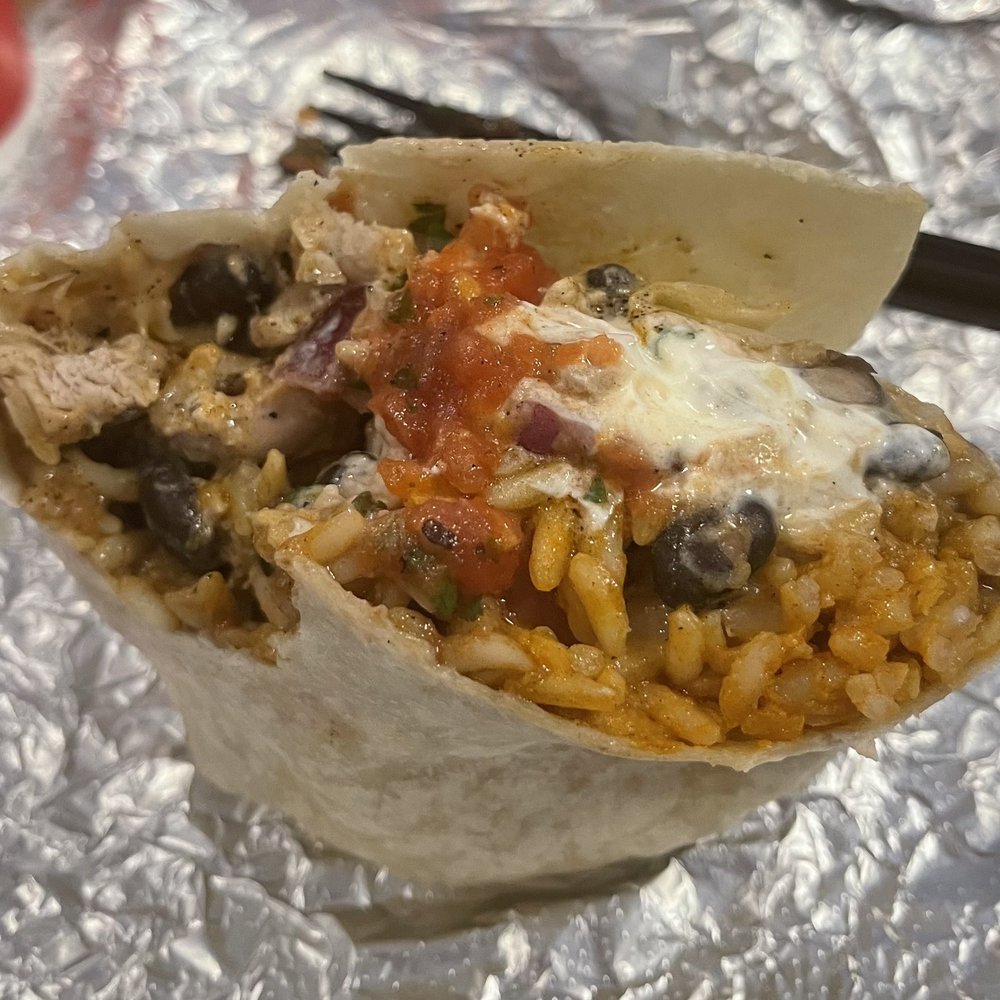 Austin's Burritos - The grilled chicken burrito that my husband and I shared.  It was pretty packed!! - Mexican Near Me - Dacula, Georgia