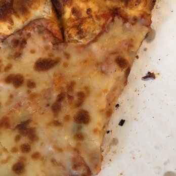 Big Horn Mercantile - two slices of pizza on a plate - Pizza Near Me - Big Horn, Wyoming Big Horn Mercantile - two slices of pizza on a plate - Pizza Near Me - Big Horn, Wyoming