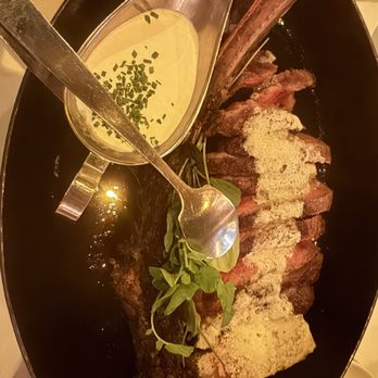J Carver’s - 45oz Tomahawk with creamy horseradish sauce - Steakhouses Near Me - Austin, Texas