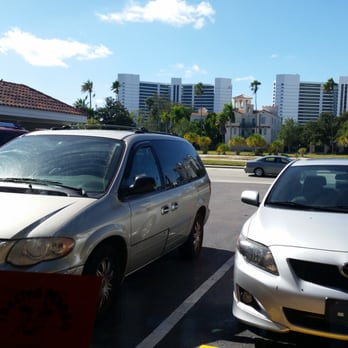 Toasted Mango Cafe - Table by the window/parking lot view. - Cafes Near Me - Sarasota, Florida