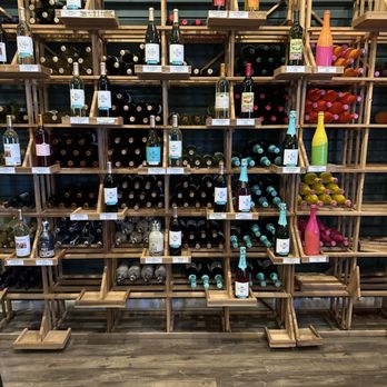 Pecos Flavors Winery + Bistro - shelves of wine bottles - Wineries Near Me - Roswell, New Mexico