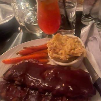 The Patten House Restaurant and Bar - Ribs, loaded potatoes and carrots. With a Cajun hurricane cocktails. - Bars Near Me - Geneva, Illinois The Patten House Restaurant and Bar - Ribs, loaded potatoes and carrots. With a Cajun hurricane cocktails. - Bars Near Me - Geneva, Illinois