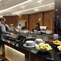 Hotel Don Giovanni - Ample breakfast buffet with varieties of eggs, breakfast meats, cold cuts, cheeses, breads, and juices.