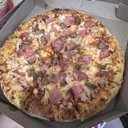 Large pizza with chicken, ham, and sausage topping pizza