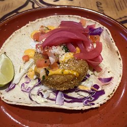 Fini's Landing - Elote Shrimp Taco . Mexican street corn, breaded crispy shrimp, roasted corn pico, Cotija, Chubasco Aioli.