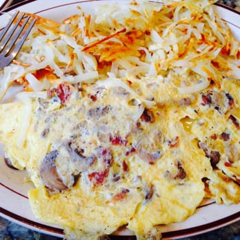 Madison Restaurant - 3 egg omelette, with bacon, mushrooms, and cheese. The home fries were slammin' - American Near Me - New York, New York Madison Restaurant - 3 egg omelette, with bacon, mushrooms, and cheese. The home fries were slammin' - American Near Me - New York, New York