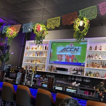 Mamacita - Apex - Bar area with liquor - New Mexican Cuisine Near Me - Apex, North Carolina Mamacita - Apex - Bar area with liquor - New Mexican Cuisine Near Me - Apex, North Carolina