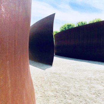 Olympic Sculpture Park - Wake is a 2004 weathering steel sculpture by Richard Serra, installed at Olympic Sculpture Park in Seattle. - Parks Near Me - Seattle, Washington Olympic Sculpture Park - Wake is a 2004 weathering steel sculpture by Richard Serra, installed at Olympic Sculpture Park in Seattle. - Parks Near Me - Seattle, Washington