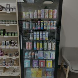 Farmhouse Artisan Market - Our drink fridge at Farmhouse Artisan Market, stocked with cannabis-infused beverages and refreshing non-infused options to keep you hydrate