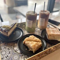 Pistachio latte, Qamaria latte, pistachio cheesecake, Walnut baklava and Caramel milk cake.