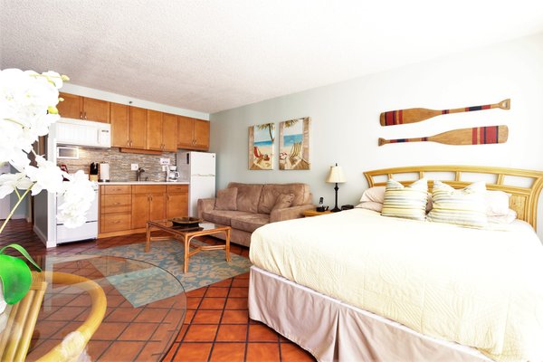 Premium Beachcomber Studio #1406 - Waikiki Place LLC’s spacious studios are located in The Marine Surf Waikiki. It is in the heart of Waikiki, a block away from the Royal Hawaiian Hotel and just minutes to the beach. Be right in the center of the action in beautiful Waikiki. Walk to beach, free Hula shows and the lively nightlife on Kalakaua Ave. Shopping and restaurants are at your doorstep.
Enjoy sitting on your own private lanai and the warm tropical air or inside the comfort of your clean, air conditioned unit listening to Hawaiian music on your stereo system, watch a movie on the cable TV provided or surf the net on the broadband internet service provided. Cook a delicious meal in the full kitchen and dining area provided or go out to eat at the dozens of great restaurants within a block of your apartment.
Want more action? Walk down to Waikiki beach or Kapiolani Park for surfing, swimming or jogging. Take the bus (bus stop adjacent to unit) to any location on the island!!! (Hanauma Bay, Pearl Harbor, North Shore or Diamond Head Crater to name just a few)
Our studios are a great alternative to hotels and most vacation rentals and give you a lot more "bang for your buck". All of our studios include:
• FULL kitchens complete with range, oven, microwave, full size refrigerators and are fully stocked (utensils, pots/pans, plates, glasses, silverware and even a starter supply of paper goods and coffee!)
• Free covered and assigned parking
• Deluxe Queen-sized bed PLUS full size sofa bed, comfortably sleeps 4
• Free phone service (US and Canada)
• Free Wi-Fi internet access
• Large Flat Screen Cable TV with DVD player
• Updated baths with “rainfall” showers
• Air-conditioning for your comfort - or take advantage of our tropical breezes!
• Amenities include a newly renovated and secured Lobby as well as pool and sundeck
• Laundry facilities on each floor for your convenience Premium Beachcomber Studio #1406 - Waikiki Place LLC’s spacious studios are located in The Marine Surf Waikiki. It is in the heart of Waikiki, a block away from the Royal Hawaiian Hotel and just minutes to the beach. Be right in the center of the action in beautiful Waikiki. Walk to beach, free Hula shows and the lively nightlife on Kalakaua Ave. Shopping and restaurants are at your doorstep.
Enjoy sitting on your own private lanai and the warm tropical air or inside the comfort of your clean, air conditioned unit listening to Hawaiian music on your stereo system, watch a movie on the cable TV provided or surf the net on the broadband internet service provided. Cook a delicious meal in the full kitchen and dining area provided or go out to eat at the dozens of great restaurants within a block of your apartment.
Want more action? Walk down to Waikiki beach or Kapiolani Park for surfing, swimming or jogging. Take the bus (bus stop adjacent to unit) to any location on the island!!! (Hanauma Bay, Pearl Harbor, North Shore or Diamond Head Crater to name just a few)
Our studios are a great alternative to hotels and most vacation rentals and give you a lot more "bang for your buck". All of our studios include:
• FULL kitchens complete with range, oven, microwave, full size refrigerators and are fully stocked (utensils, pots/pans, plates, glasses, silverware and even a starter supply of paper goods and coffee!)
• Free covered and assigned parking
• Deluxe Queen-sized bed PLUS full size sofa bed, comfortably sleeps 4
• Free phone service (US and Canada)
• Free Wi-Fi internet access
• Large Flat Screen Cable TV with DVD player
• Updated baths with “rainfall” showers
• Air-conditioning for your comfort - or take advantage of our tropical breezes!
• Amenities include a newly renovated and secured Lobby as well as pool and sundeck
• Laundry facilities on each floor for your convenience