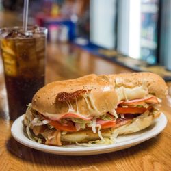 India Oak Grill - Club Sub-- Stacked with provolone, swiss, ham & bacon
