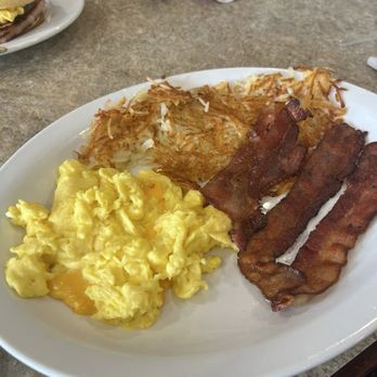 Cafe Stelio's - Stelios Combo...Soft scrambled eggs with American cheese, hash browns and bacon. Not pictured, the Snickerdoodle French toast. - Breakfast & Brunch Near Me - Merrillville, Indiana