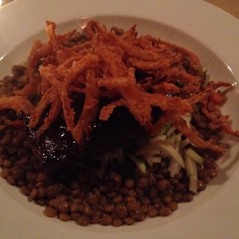Thyme - Local pork belly over a bed of lentils and jicama topped with onion strings - New American Near Me - White River Junction, Vermont