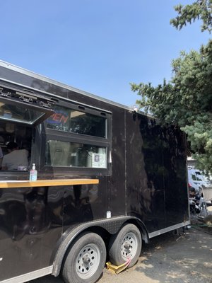 Photo of La Osita - Portland, OR, US. a black food truck parked in a parking lot