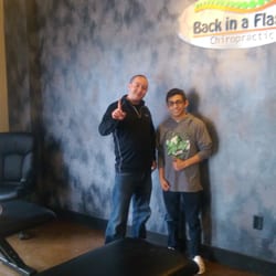 Back in a Flash Chiropractic and Massage - Two time wrestling Colorado State 5A Champion Tomas Gutierrez with Dr. Perea at the office.