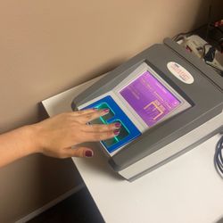 Southern California Security & Firearms Academy - Here our technician, Samantha, is showing how to properly separate and place your fingers on the glass while it scans them!