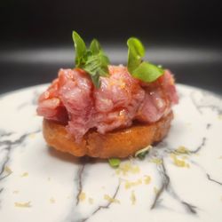 A Different Beast - TORO CRUDO, paprika and garlic oil, lemon zest, sorrel