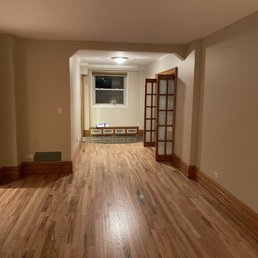 an empty room with wood floors an empty room with wood floors