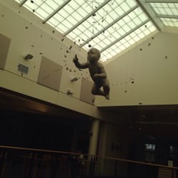 West St. Petersburg Community Library - Hanging baby sculpture in the atrium