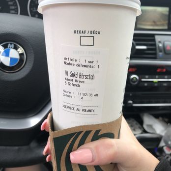 Starbucks - a hand holding a cup of coffee - Coffee & Tea Near Me - L'Île-Perrot, Quebec Starbucks - a hand holding a cup of coffee - Coffee & Tea Near Me - L'Île-Perrot, Quebec