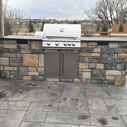 J & P Landscaping - 9' long outdoor kitchen with Blaze grill and granite countertop.