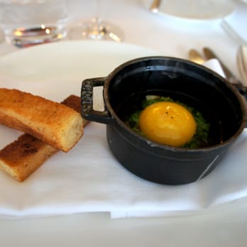 Auberge du Pommier - oeuf en cocotte: steamed egg white, soft yolk, creamed spinach, jus de poulet, les petits soldats croquant - French Near Me - Toronto, Ontario