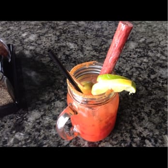Topgolf - Bloody Mary with beef jerky straw - New American Near Me - Austin, Texas Topgolf - Bloody Mary with beef jerky straw - New American Near Me - Austin, Texas