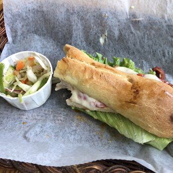 Saranac Sourdough Deli - a sandwich with a side of salad - Delis Near Me - Lake Placid, New York Saranac Sourdough Deli - a sandwich with a side of salad - Delis Near Me - Lake Placid, New York