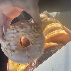 Andrews Donuts - White iced doughnut with nuts