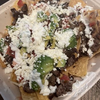 El Camaleon Mobile Kitchen - Carne Asada Nachos (no jalapeños for Gavin). - Food Trucks Near Me - San Jose, California El Camaleon Mobile Kitchen - Carne Asada Nachos (no jalapeños for Gavin). - Food Trucks Near Me - San Jose, California