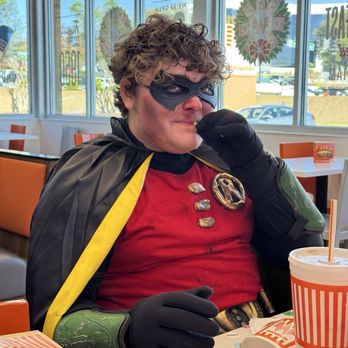 Whataburger - A super hero eating delicious French fries. - Burgers Near Me - Duluth, Georgia