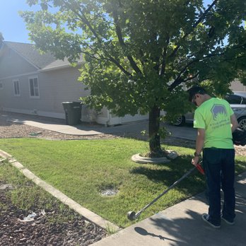 A Cut Above - ACA Staff edging a lawn - Landscaping Near Me